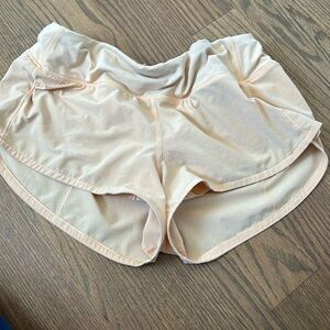 Lululemon 2.5 inch speed ups. Size 6 in light orange color.